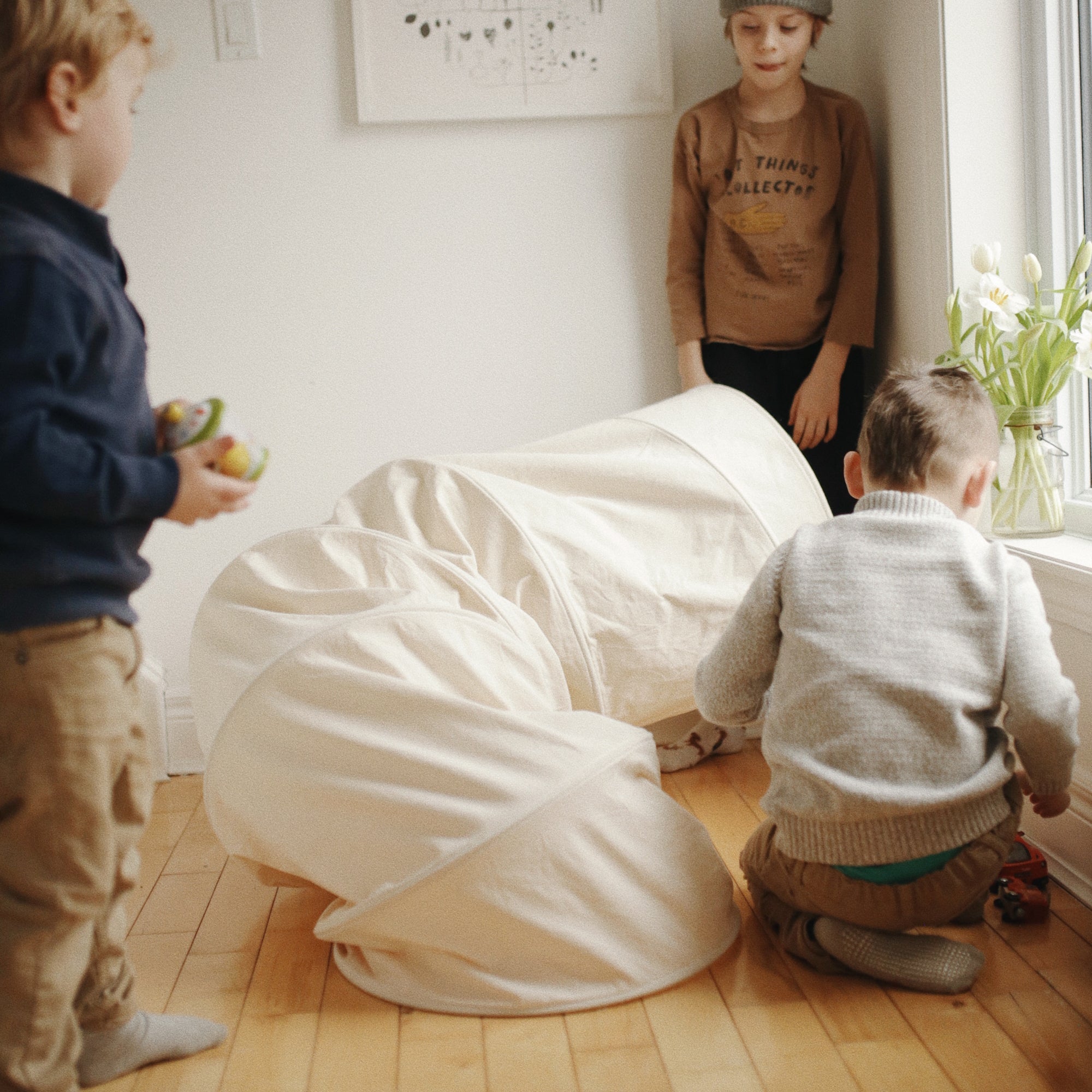 Kinderfeets Pikler Play Tunnel in vibrant colors, soft fabric, and lightweight design for safe crawling and play activities.