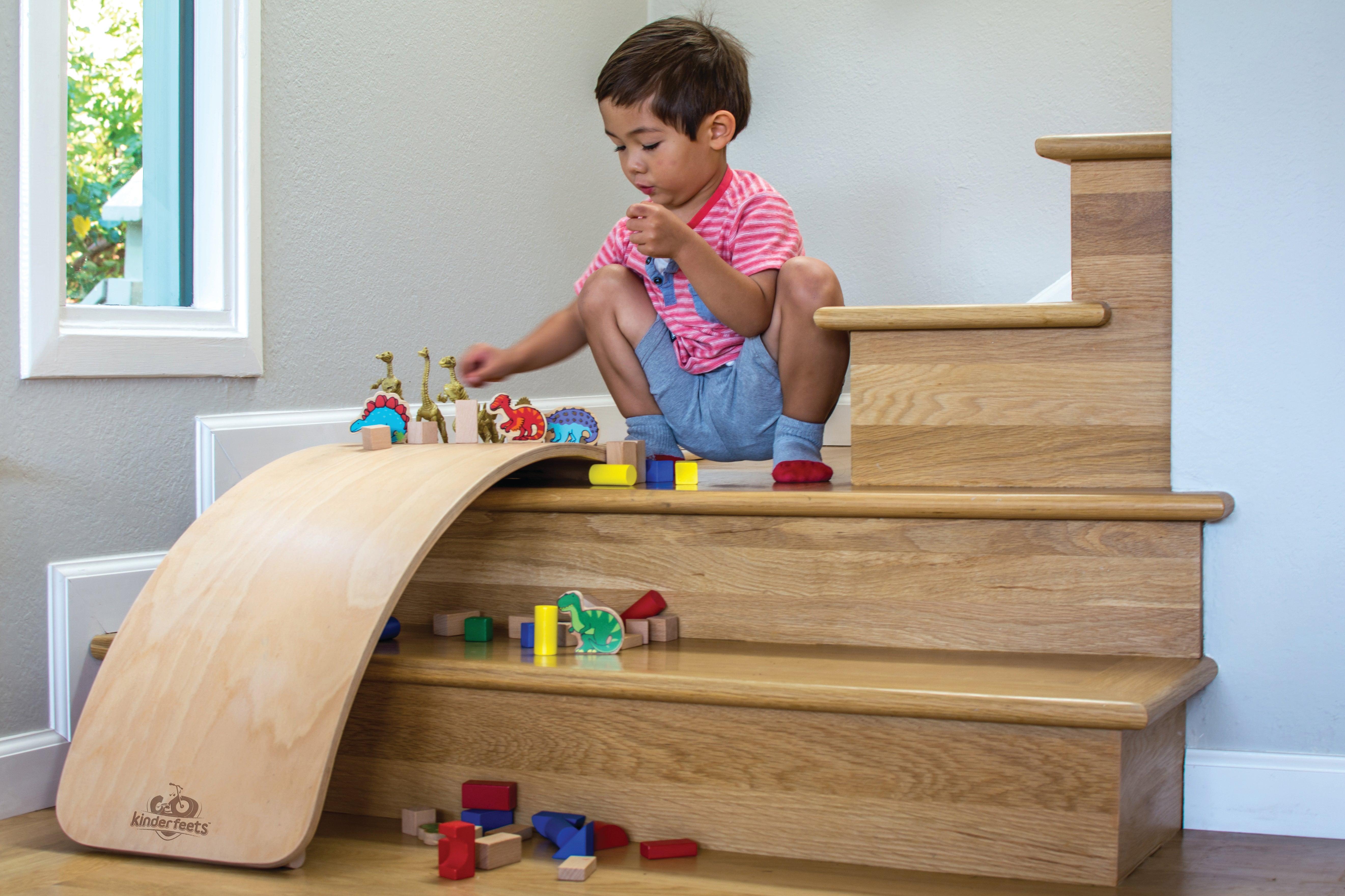 Kinderfeets Kinderboard in natural wood finish, featuring a compact, balanced wooden skateboard for kids' play and balance training.