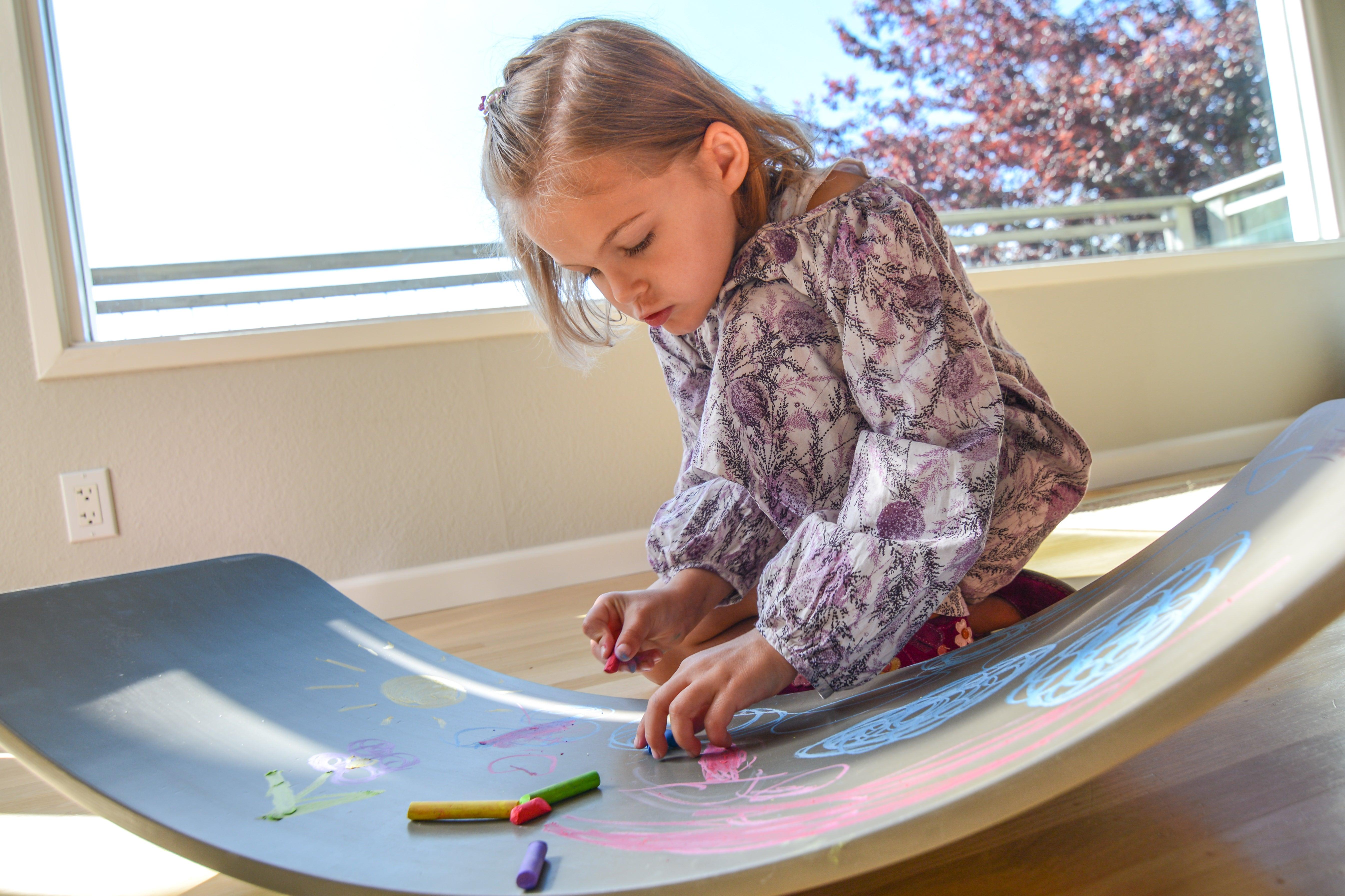Kinderfeets Kinderboard chalkboard balance board with wooden frame and black chalkboard surface for kids' play and balance training