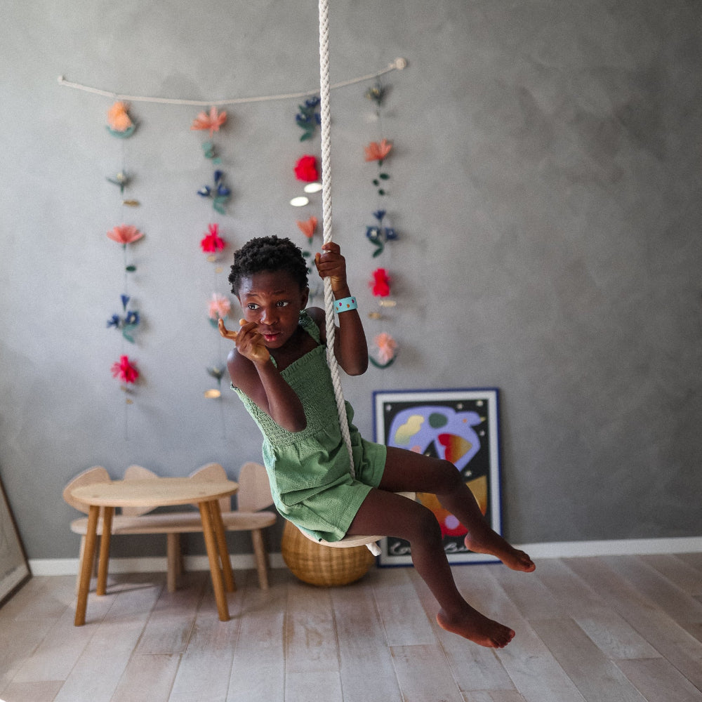 Colorful Kinderfeets Swinging Disc toy with a vibrant design, perfect for children’s active play and sensory development.