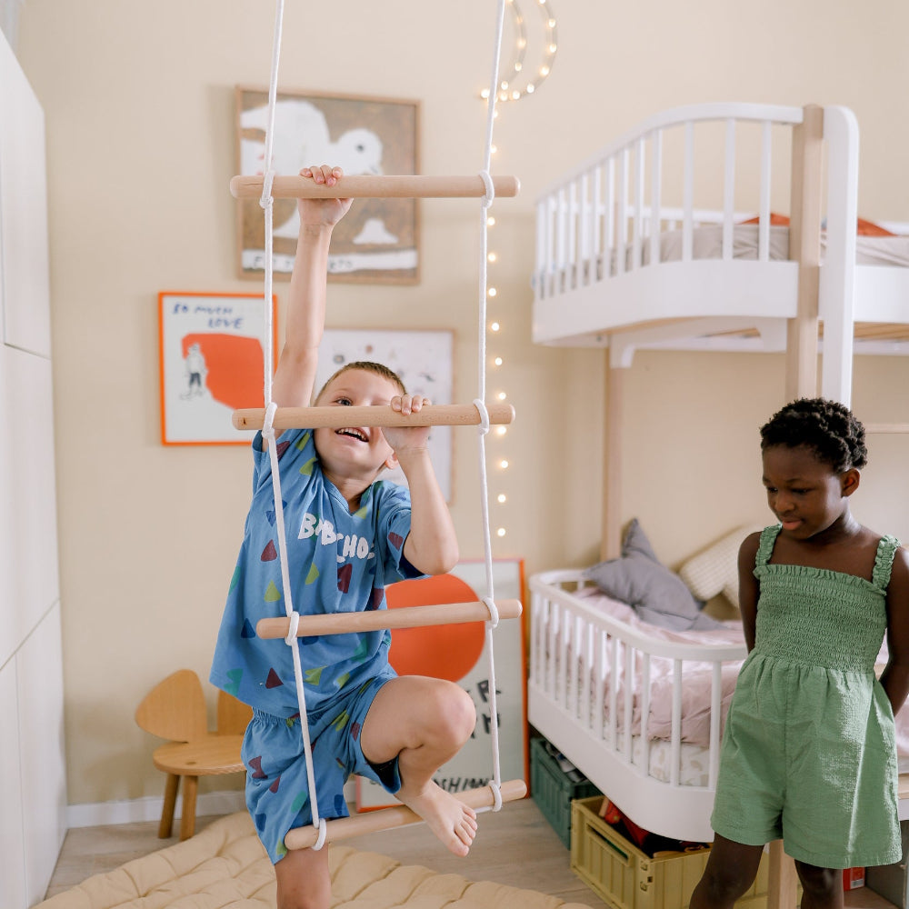 Kinderfeets climbing ladder toy with colorful wooden steps and handrails, designed for safe indoor play and climbing fun.