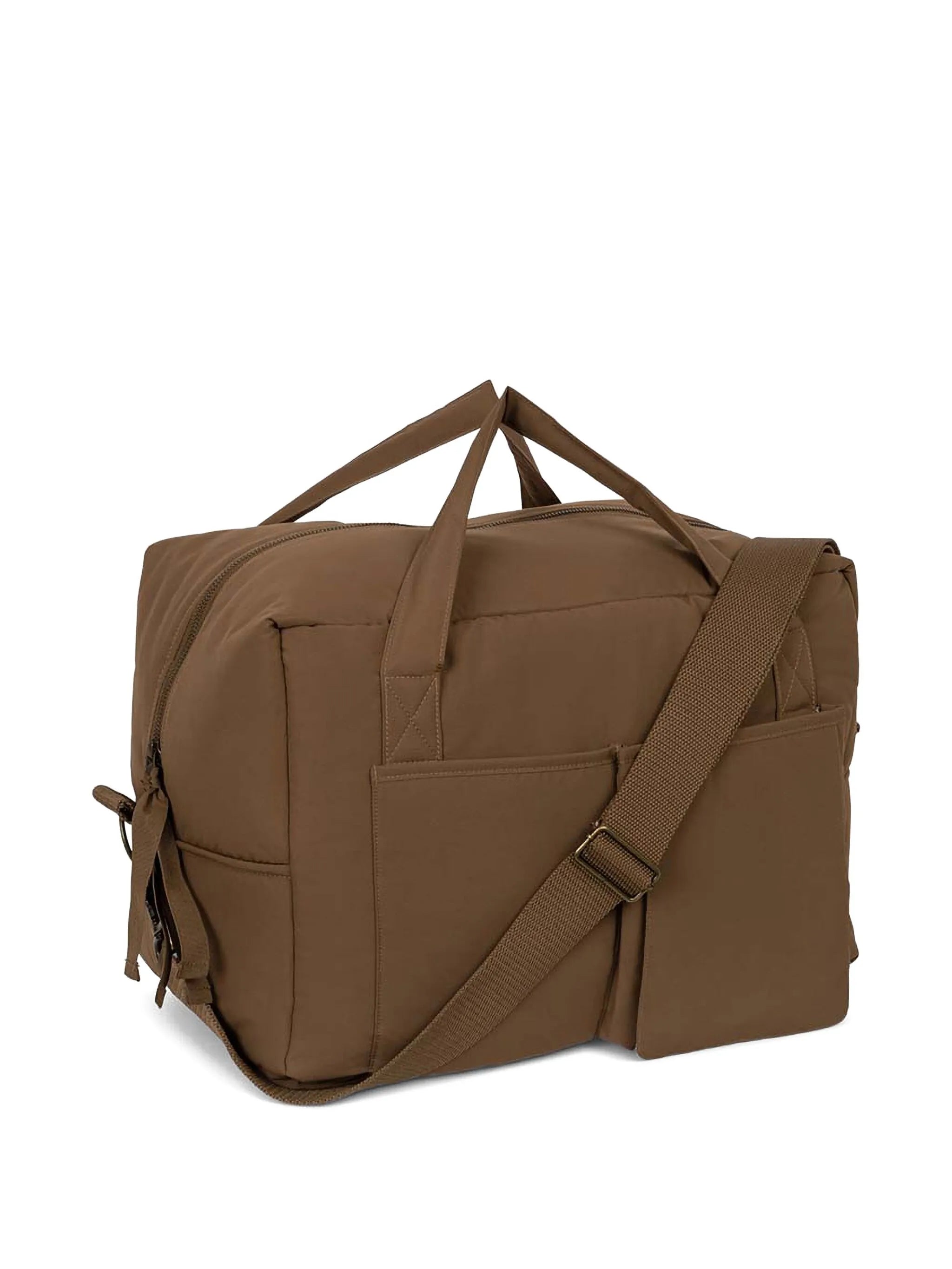 Konges Slojd All You Need Bag in walnut with leather handles, featuring spacious design and natural woven texture.