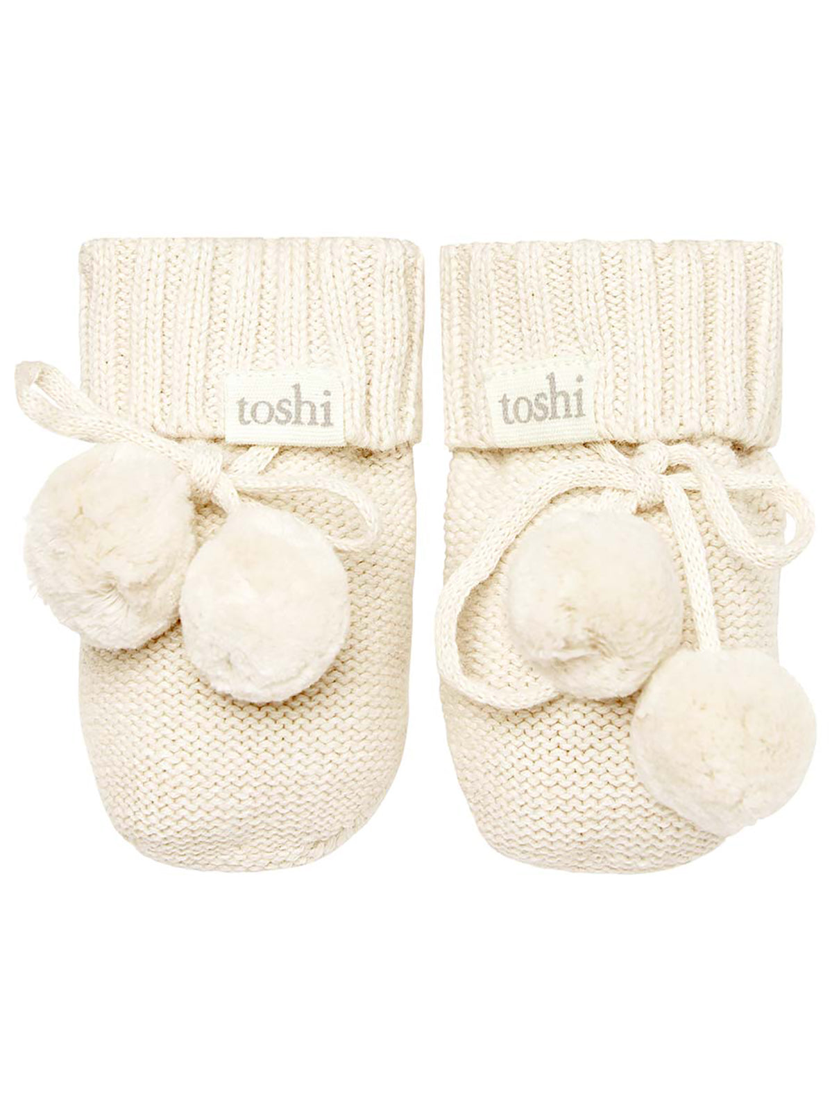 Cream Toshi organic baby booties with soft fabric and cute design, perfect for cozy infants' footwear.