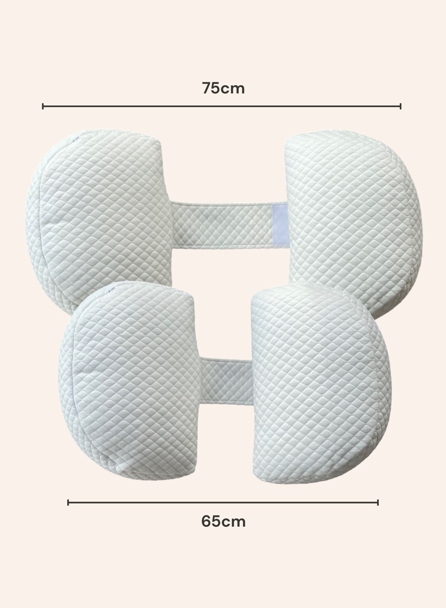 Belly Bliss pregnancy pillow in soft fabric, shaped for support and comfort during pregnancy, shown in a cozy bedroom setting.
