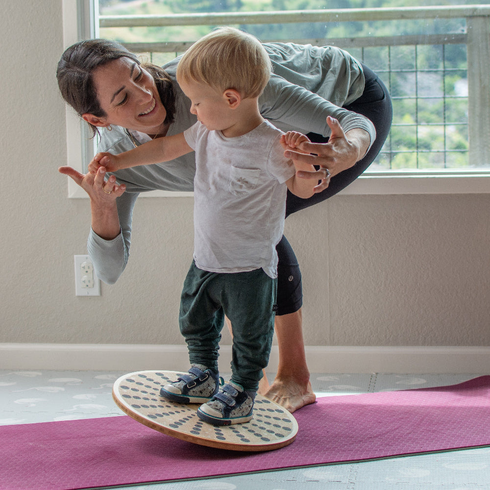Kinderfeets Bamboo Balance Disc for kids, round balance disk made of bamboo, used for stability and active play.