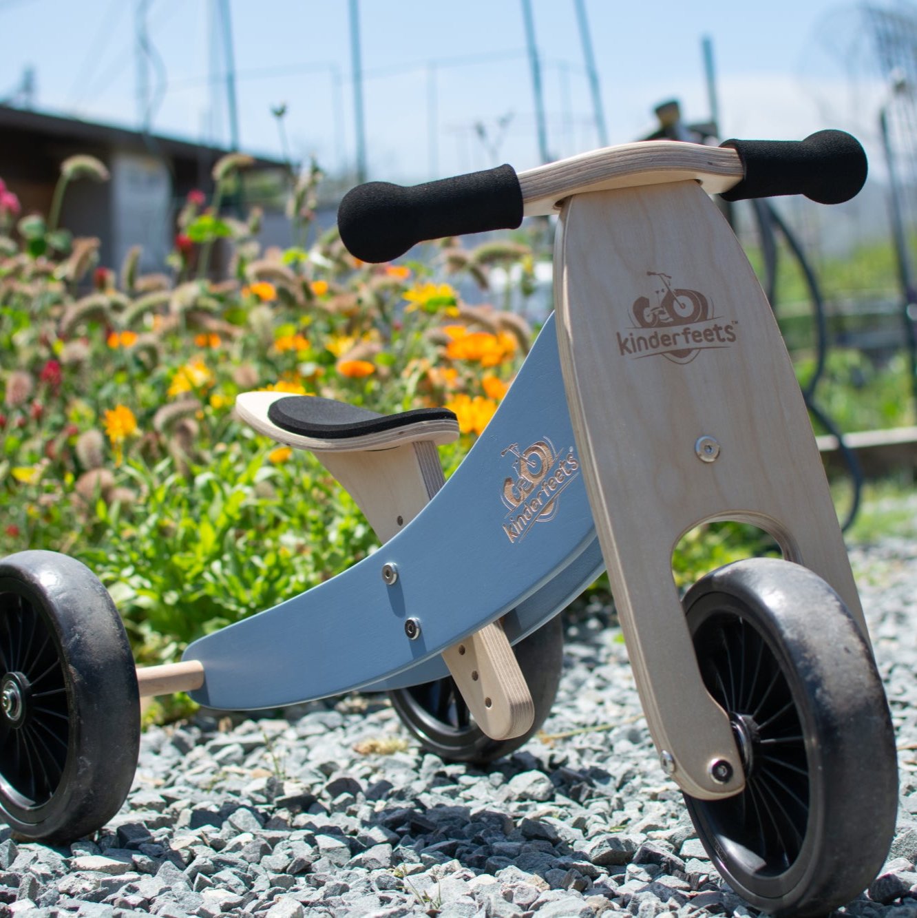 Kinderfeets Tiny Tot Plus slate blue trike and balance bike for toddlers, featuring a sturdy frame and toddler-friendly design.