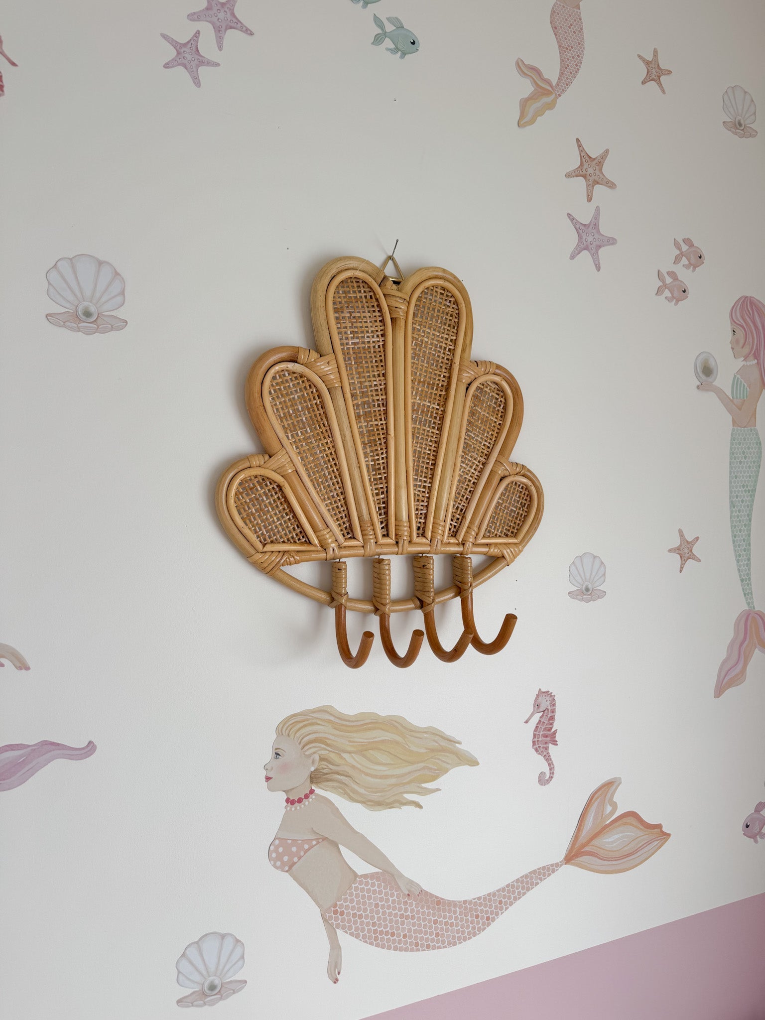 INKAH Rattan clam wall hook by Inkah Limited, natural rattan design with clam shape for hanging accessories or decor.