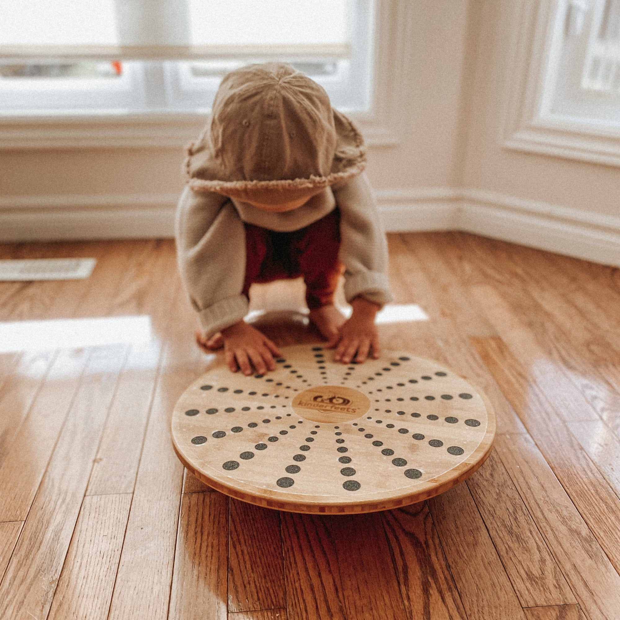 Kinderfeets Bamboo Balance Disc for kids, round balance disk with natural bamboo finish for stability and fun exercise.