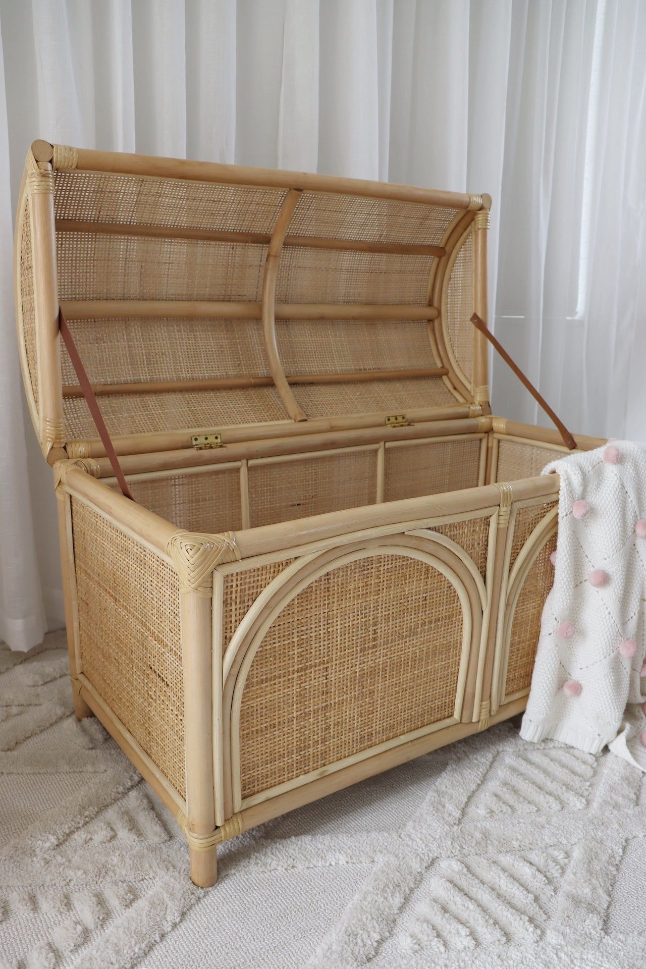 Large INKAH Rattan toy chest by Inkah Limited with woven rattan design and sturdy lid, ideal for children's toy storage.