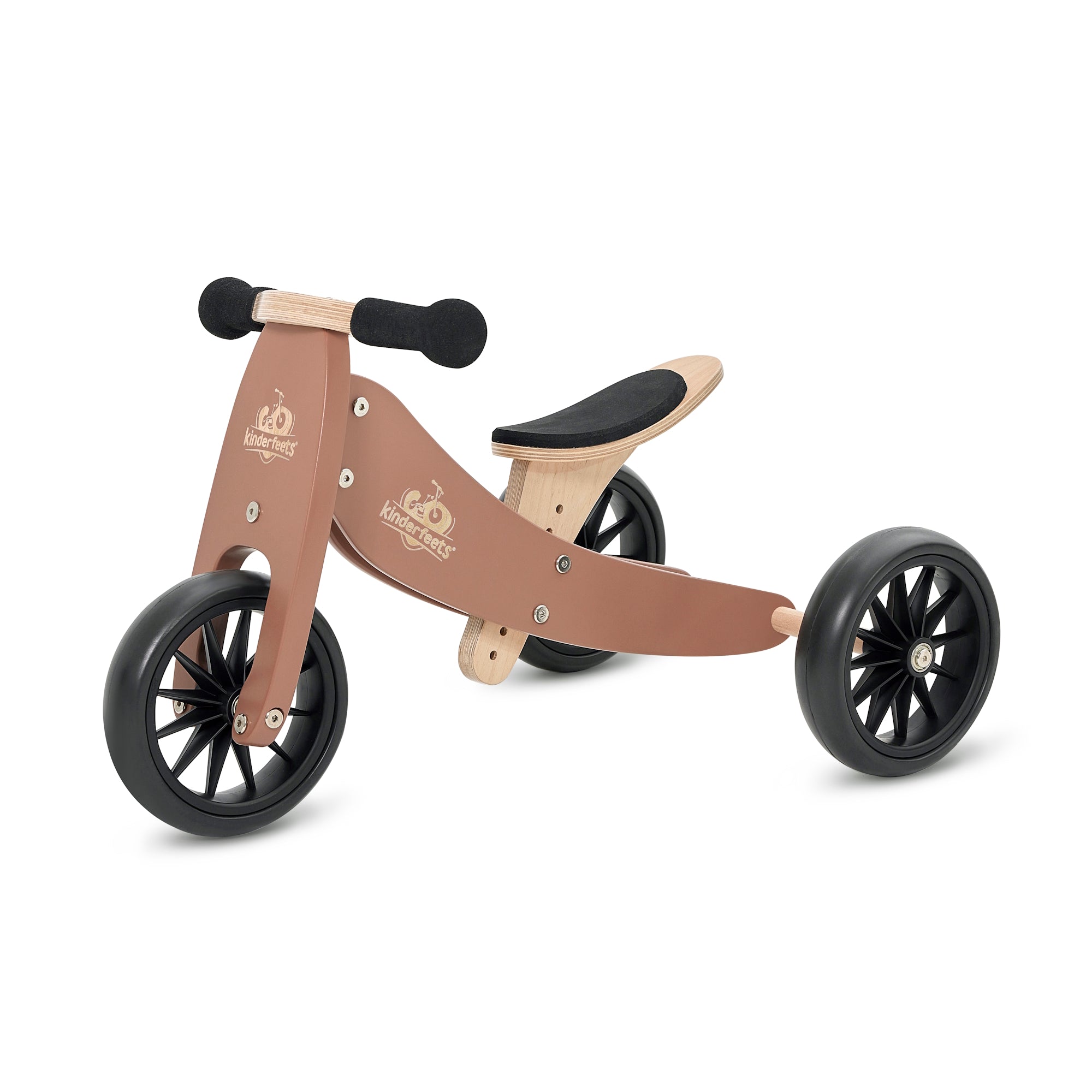 Kinderfeets Tiny Tot Mocha balance bike with a wooden frame and padded seat, designed for young children learning to pedal.