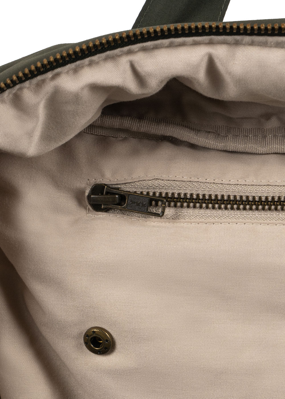 Konges Slojd All You Need Bag in moss grey, featuring a soft fabric exterior and sturdy straps for versatile carrying.