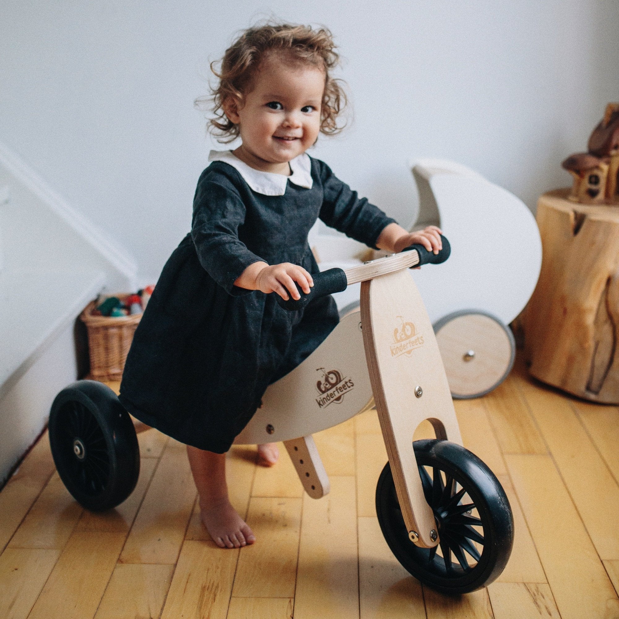 Kinderfeets Tiny Tots Plus slate grey trike and balance bike for toddlers, featuring a sturdy frame and comfortable design.