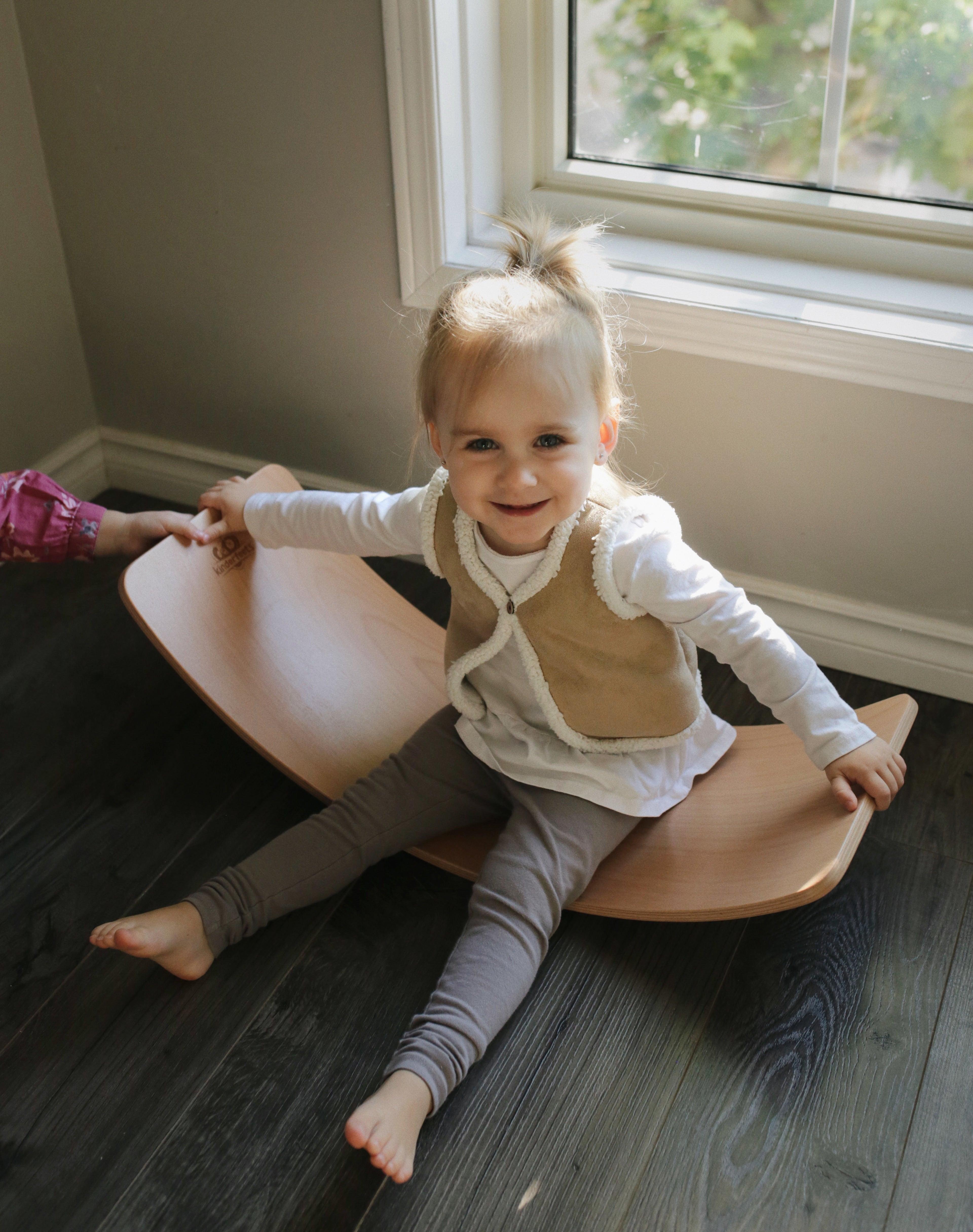 Kinderfeets Kinderboard Lite balance board in natural wood finish, designed for stability and fun for kids.