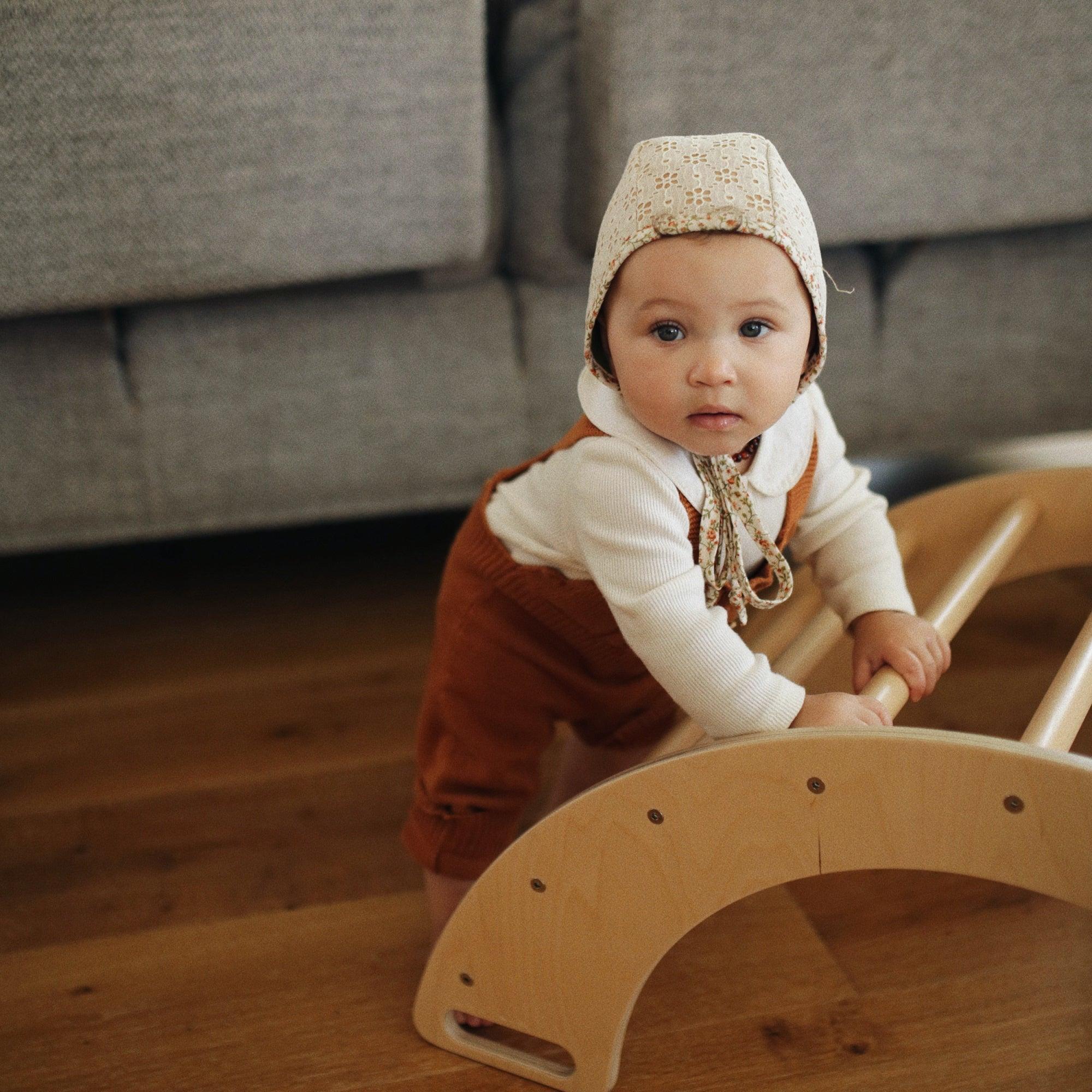 Kinderfeets Pikler climbing and rocking arch, wooden climbing toy with smooth finish for children’s play and development.