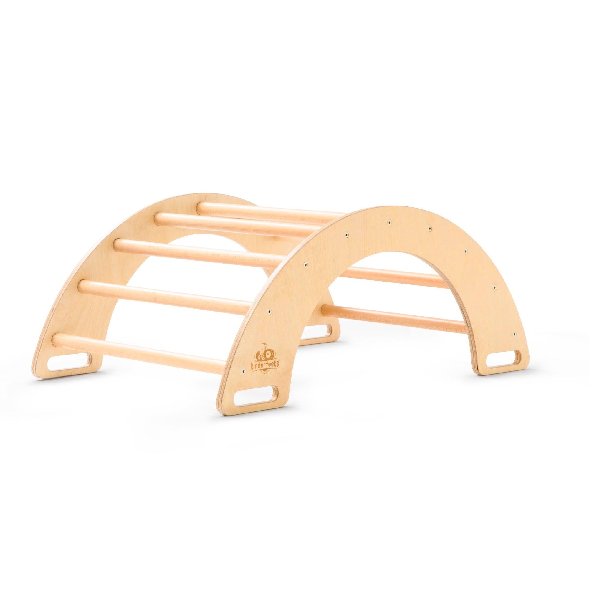 Kinderfeets Pikler rocking and climbing arch, a wooden climbing toy with a curved arch for safe play and balance development.