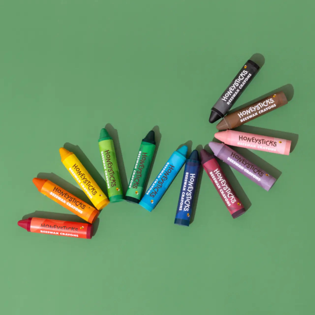 Set of 12 Honeysticks Beeswax Crayons Jumbos in various bright colors, ideal for young children, with natural beeswax texture.
