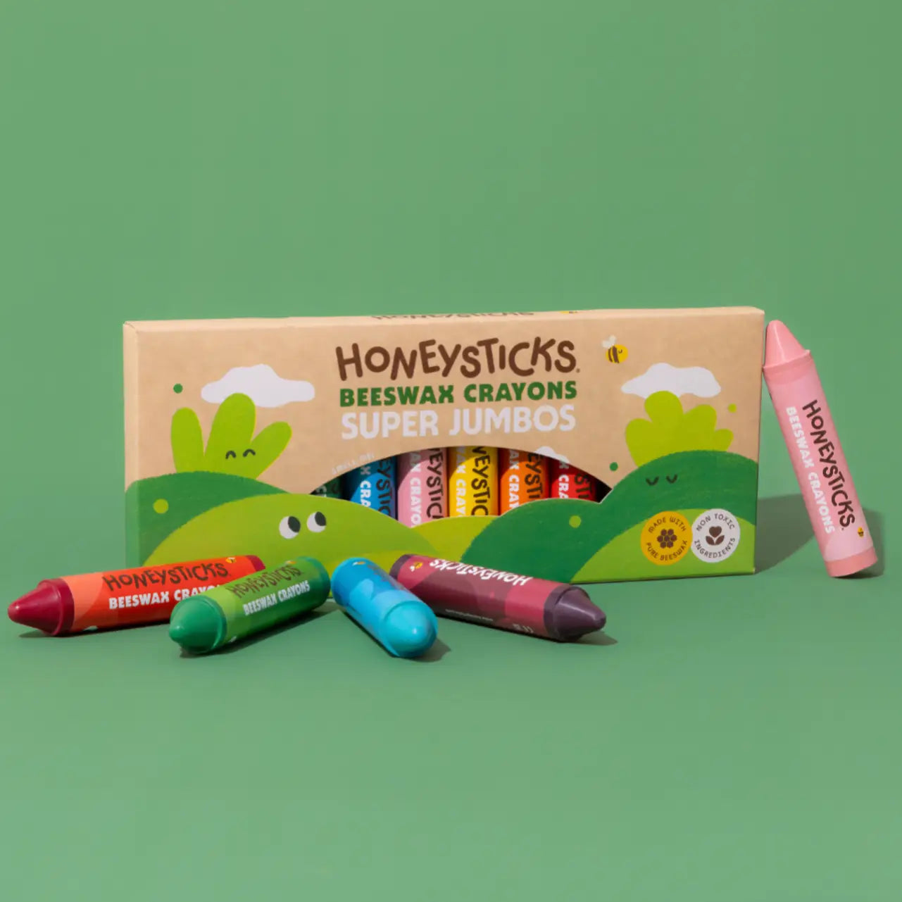 Set of 12 Honeysticks Beeswax Crayons Jumbos in bright colors, shown in a colorful display with their natural beeswax finish.