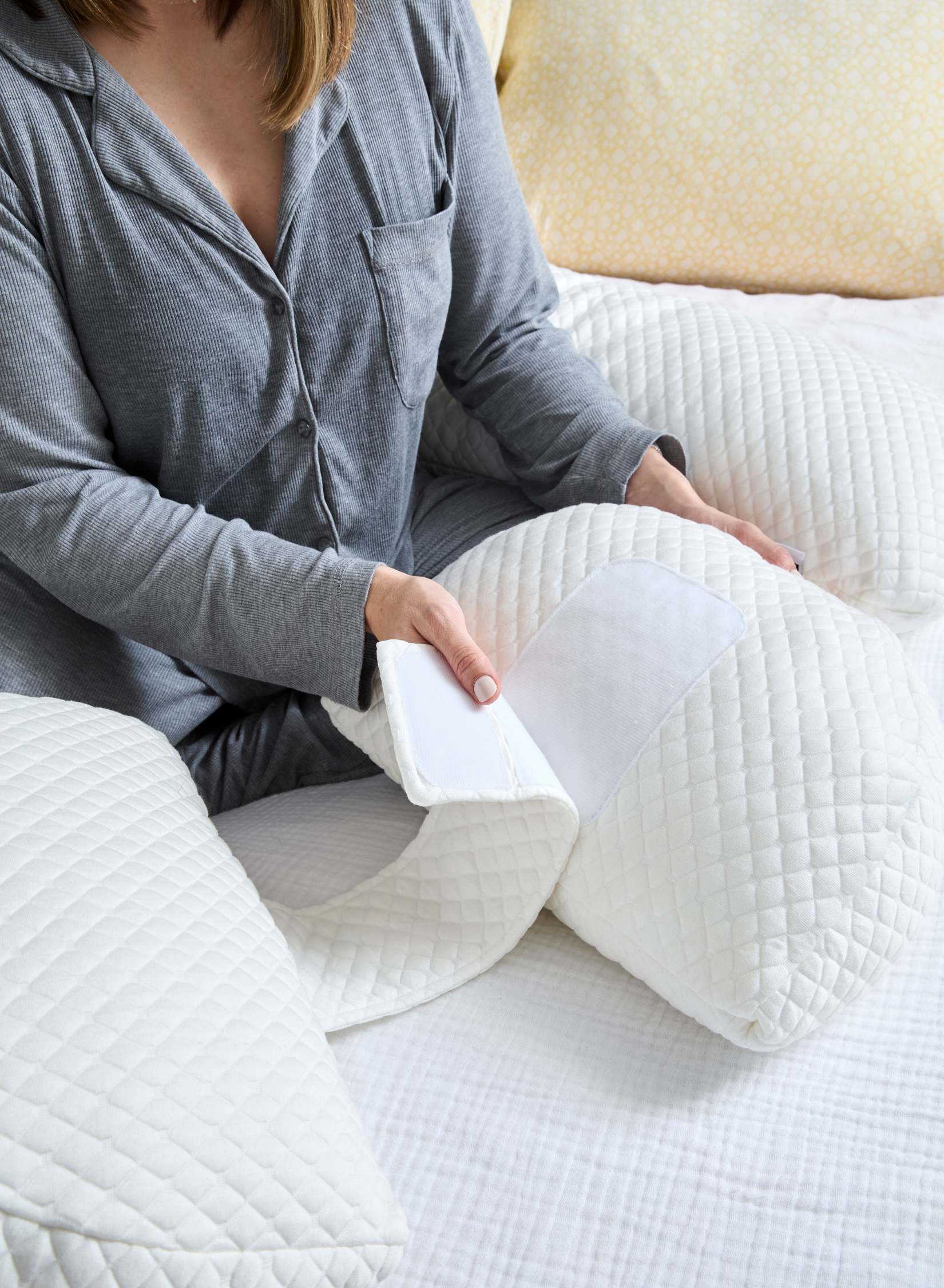 Belly Bliss pregnancy pillow in a cozy, U-shaped design with soft fabric for comfortable support during pregnancy.