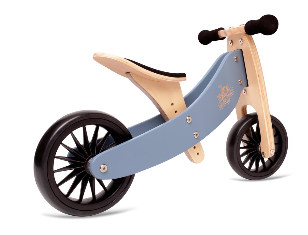 Kinderfeets Tiny Tot Plus slate blue balance bike for toddlers, featuring a lightweight frame and ergonomic handlebars.