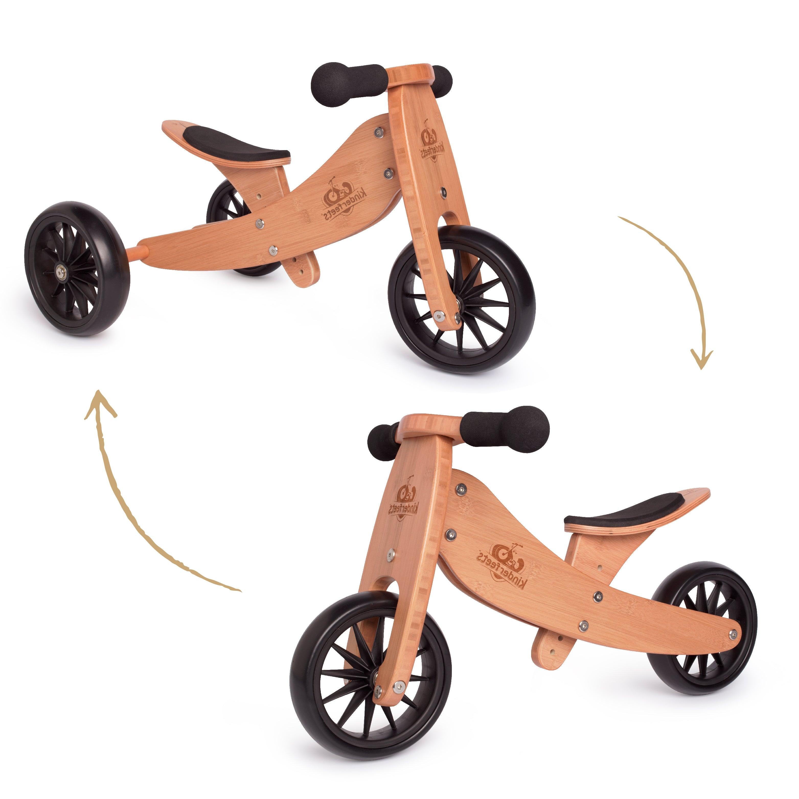 Kinderfeets Tiny Tot trike in coral, a compact balance bike for young children, with a wooden frame and colorful design.
