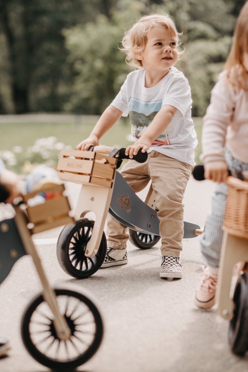 Kinderfeets Tiny Tot Plus slate blue trike and balance bike for toddlers, with a sturdy frame and ergonomic design.