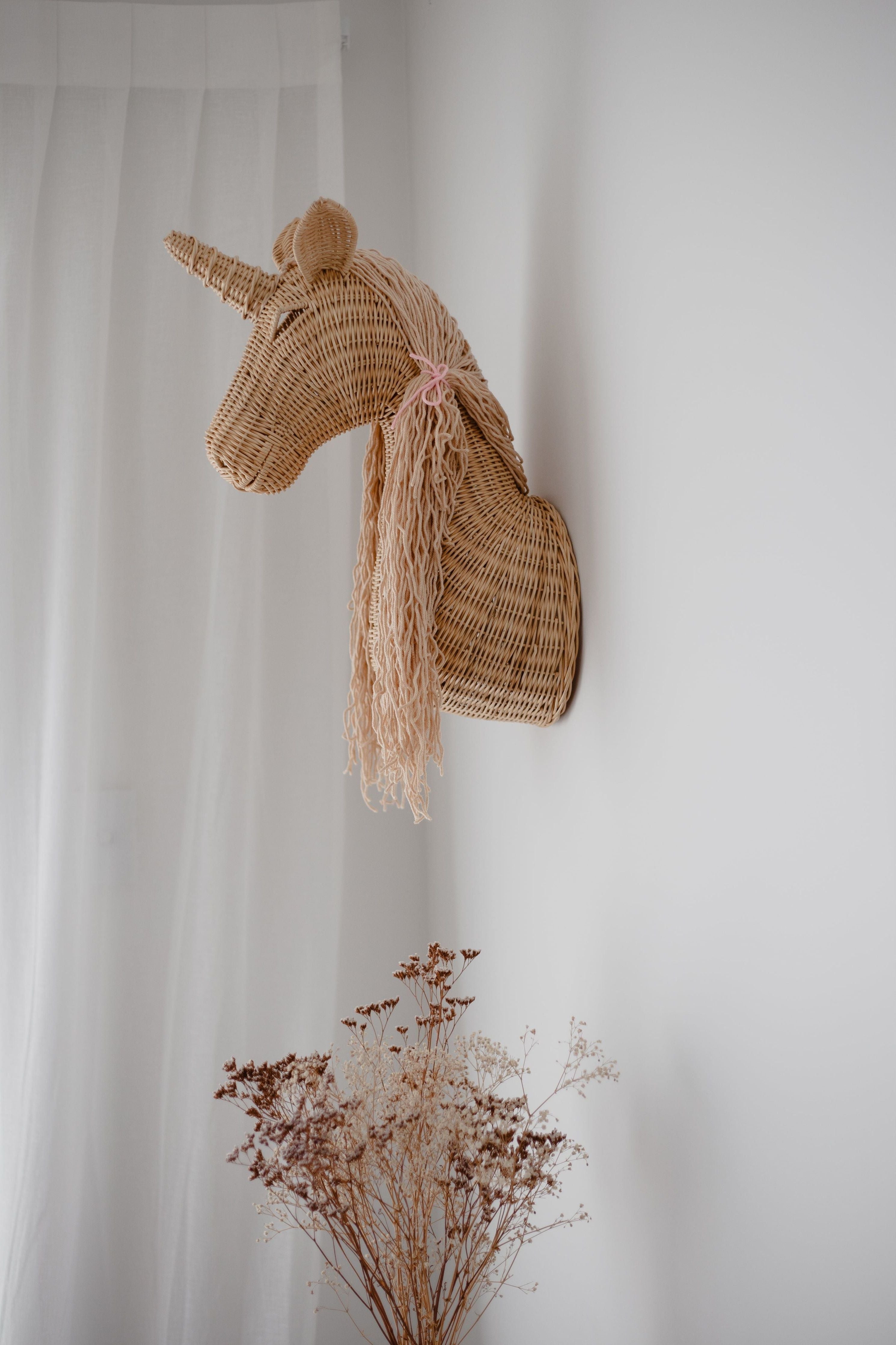 Rattan unicorn wall mount by Inkah Limited featuring a detailed, handcrafted unicorn figure for wall decor.