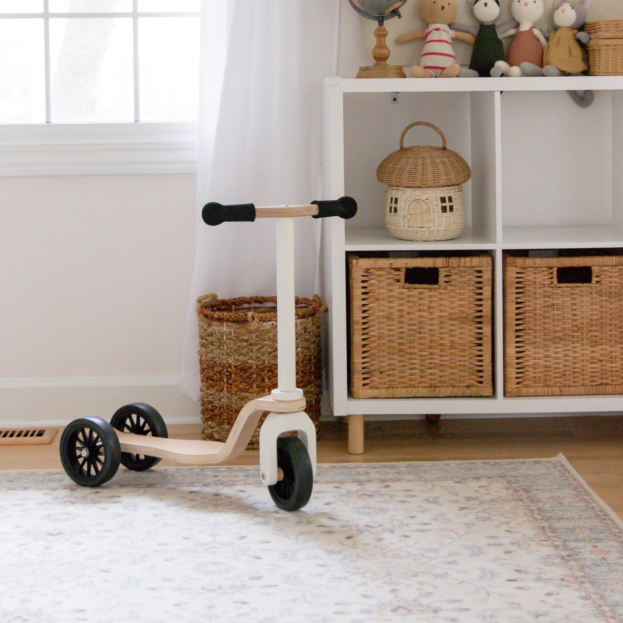 Kinderfeets scooter for kids with colorful handlebar grips and sturdy wooden deck, perfect for young children learning to ride.