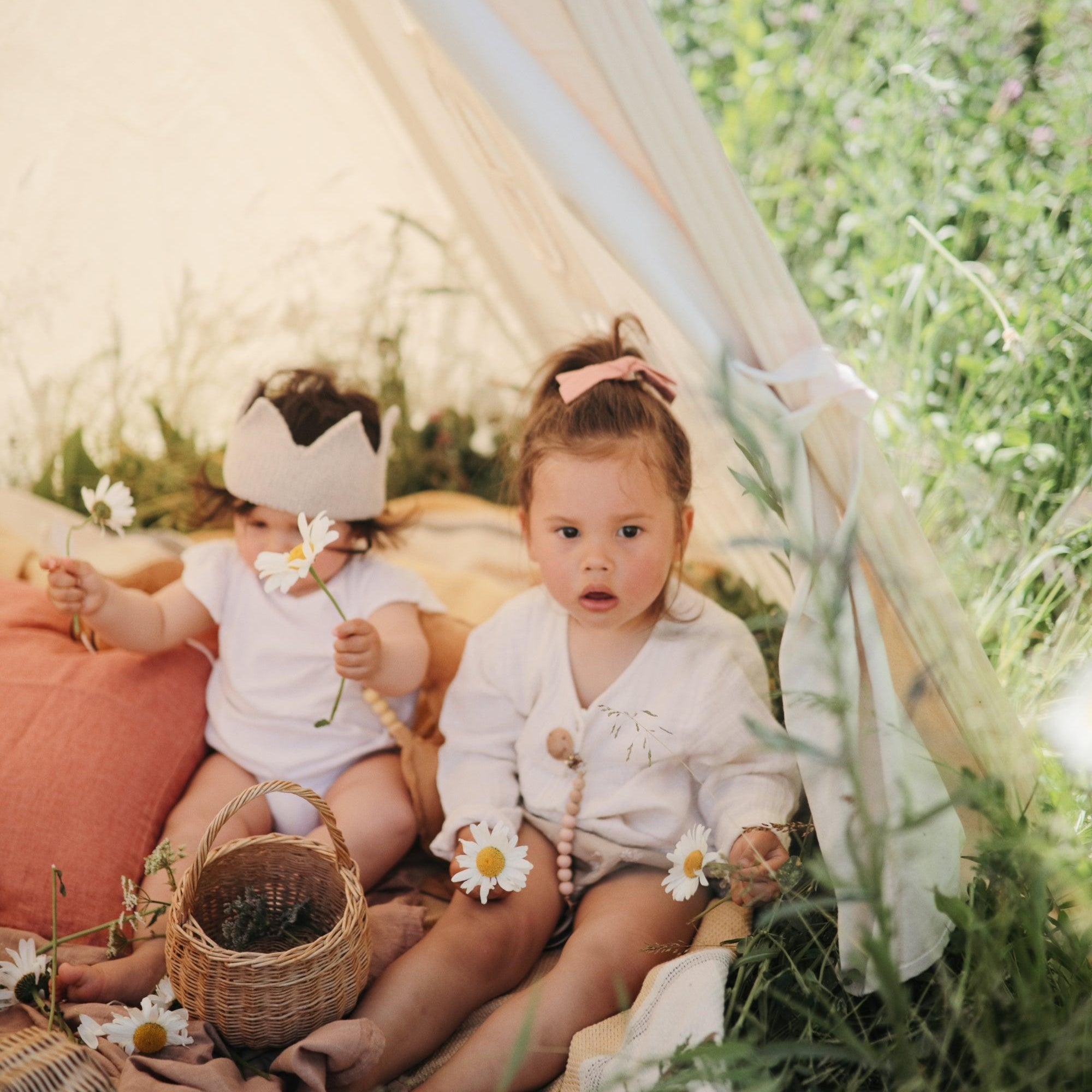 Kinderfeets Play Tent set up with colorful fabric panels and a playful design, perfect for children's indoor play and imagination.