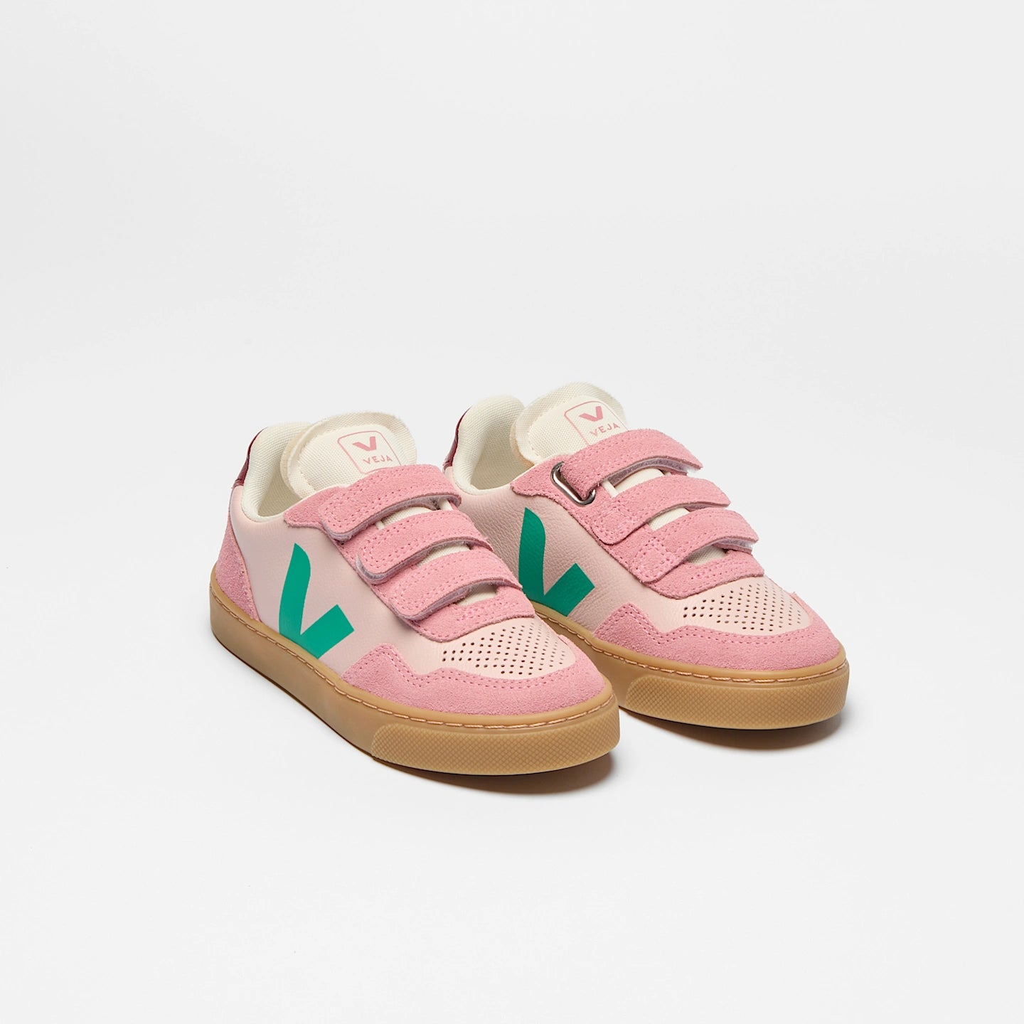 Pink VEJA Small V-90 leather sneakers with Petale Mary tag, showcasing organic leather construction and stylish design.