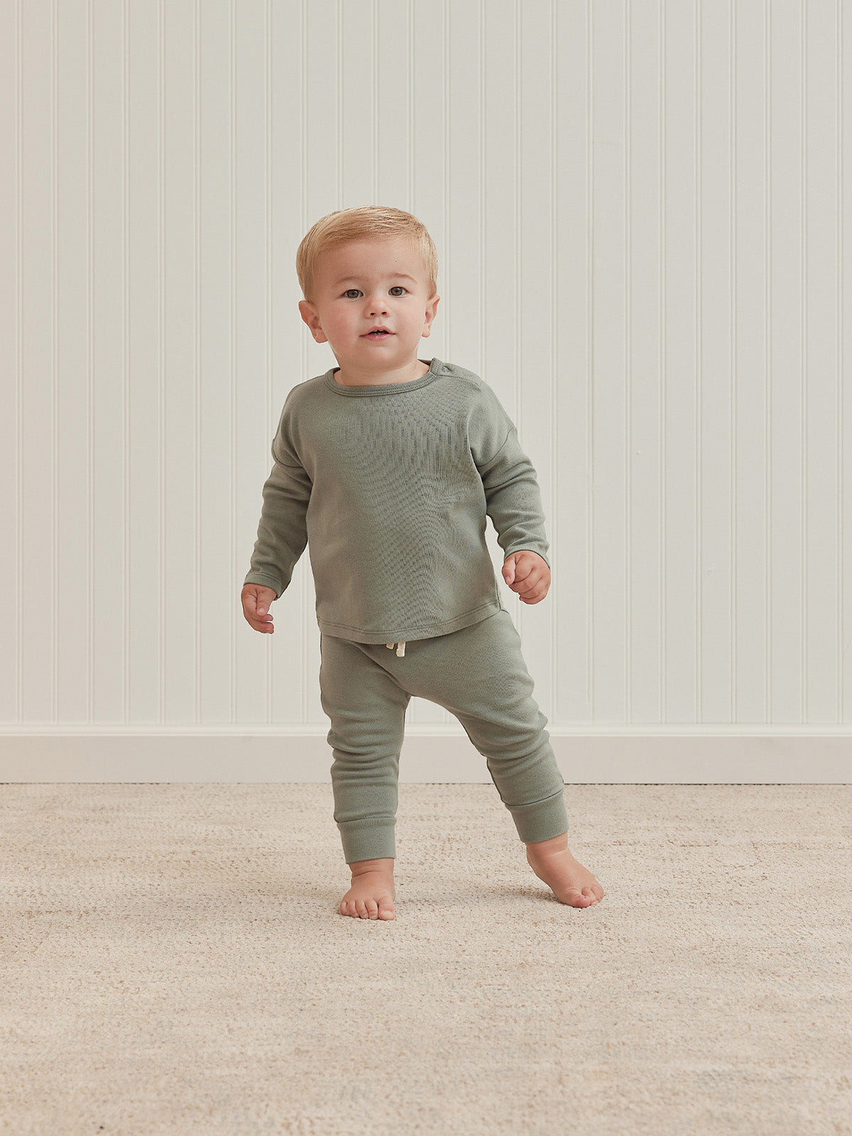 Quincy Mae ribbed sky blue leggings for children, close-up of soft, ribbed fabric and elastic waistband.