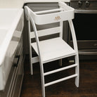 Kinderfeets Pikler Observation Tower in white, wooden toddler climbing and play structure with safety rails and steps.