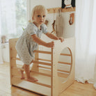 Kinderfeets Pikler Cube climbing toy with colorful wooden blocks for kids to explore and develop motor skills.