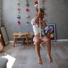 Kinderfeets Swinging Disc toy with colorful design, suitable for young children, shown with vibrant patterns and playful elements.