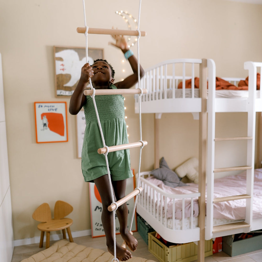 Kinderfeets climbing ladder toy for kids, featuring colorful wooden rungs and side supports, designed for safe indoor play.