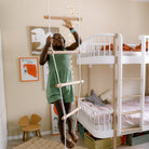 Kinderfeets climbing ladder toy for kids, featuring colorful wooden rungs and side supports, designed for safe indoor play.