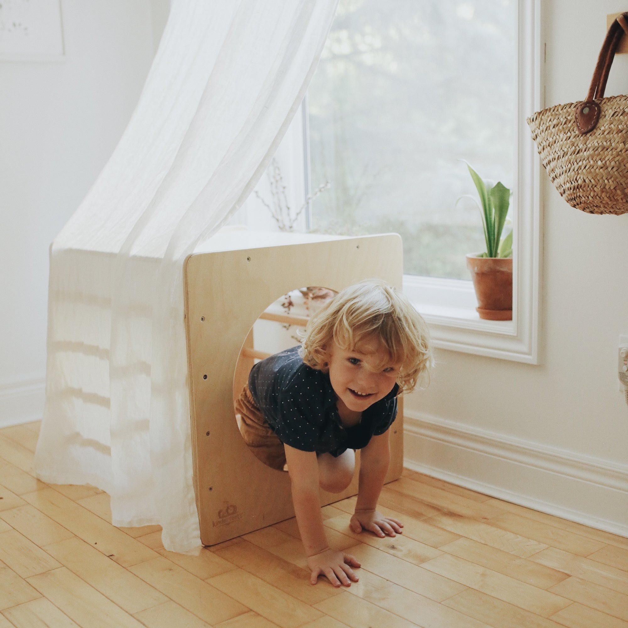 Kinderfeets Pikler Cube climbing toy with colorful wooden blocks for safe, open-ended play and motor skill development.