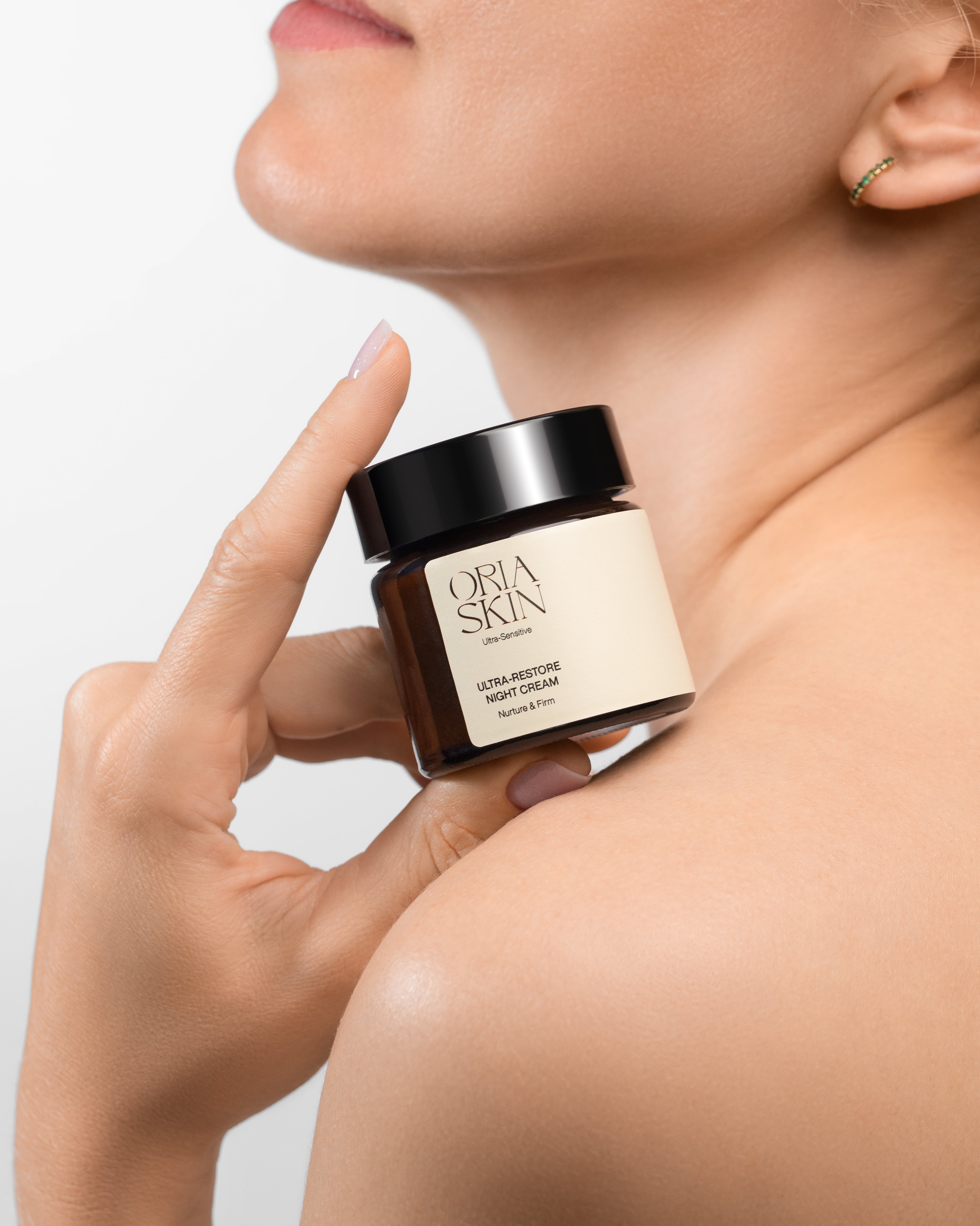 Oria Skin Ultra-Restore Night Cream jar with white and gold packaging, skincare product for overnight skin renewal.
