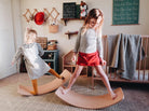 Kinderfeets Kinderboard chalkboard balance board with wooden construction and a chalk surface for kids to draw and play.