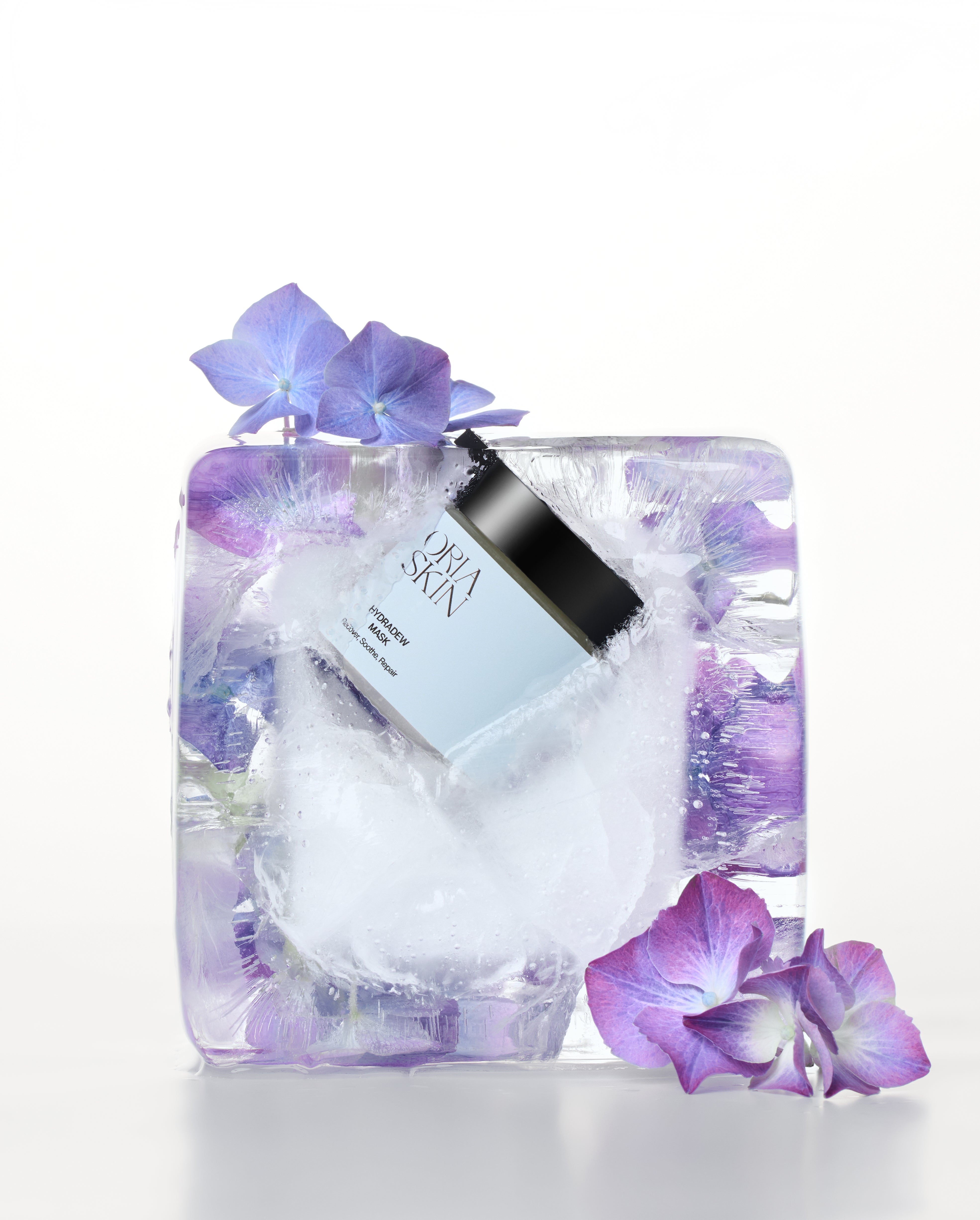 Oria Skin HydraDew Mask spread on a white surface, showing a hydrating facial mask with a smooth, gel-like texture.