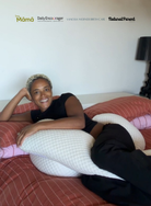 Belly Bliss pregnancy pillow showing its contoured shape and soft fabric cover, designed for comfort during pregnancy.