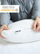 Belly Bliss pregnancy pillow in soft fabric, shaped to support pregnant belly and back during rest and sleep.