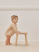 Quincy Mae Quincy Mae crewneck bubble romper for babies in sun print, soft fabric with long sleeves and snap closures.