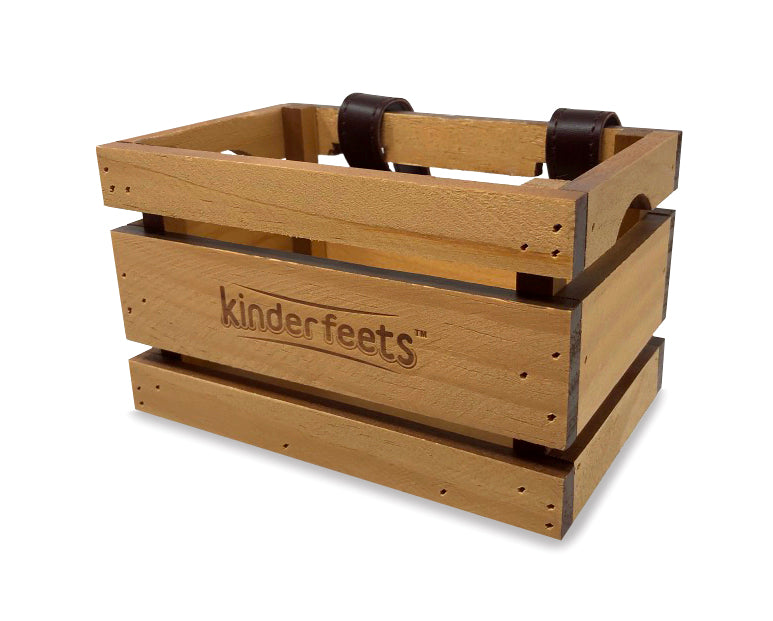 Wooden crate from Kinderfeets balance bike, showcasing natural wood finish and sturdy construction for storage or display.