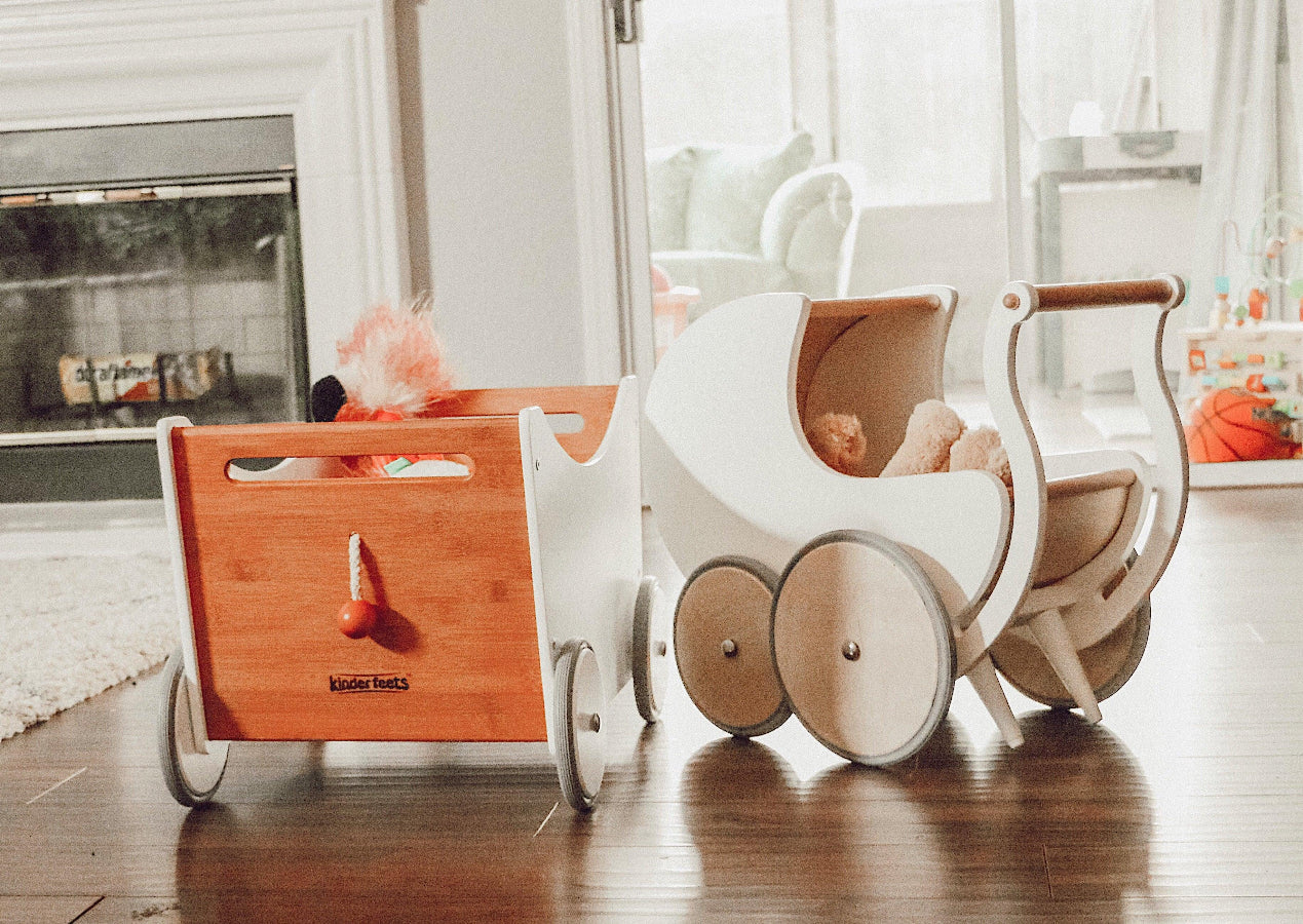 Kinderfeets wooden pram walker in white, designed for toddlers, featuring a classic toy with adjustable parts and colorful details