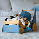 Kinderfeets Cargo Walker wooden toy in slate blue with natural wood accents, designed for early walkers and imaginative play.