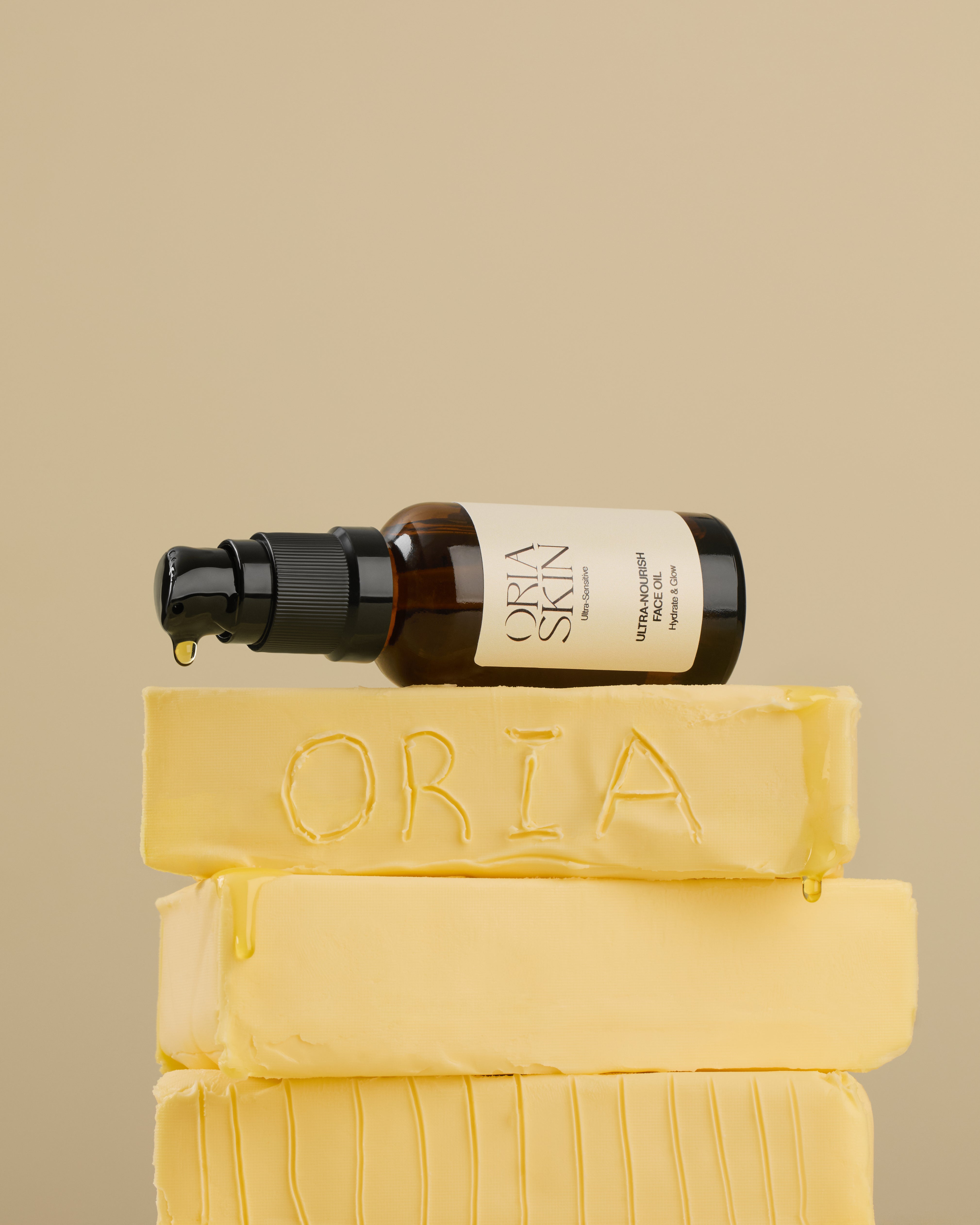 Oria Skin Ultra-Nourish Face Oil in a clear glass bottle with dropper, designed for hydrating and nourishing skin.