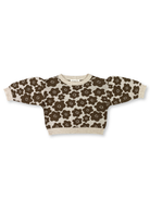 Grown Flower Drum knitted pull over in soft fabric, featuring a floral pattern and cozy fit, displayed on a neutral background.