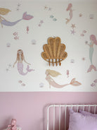 INKAH Rattan clam wall hook by Inkah Limited, featuring a woven rattan clam design mounted on a wall for decorative storage.