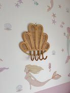 INKAH Rattan clam wall hook by Inkah Limited, natural rattan design with clam shape for hanging accessories or decor.