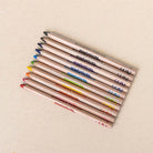 Set of ten Honeysticks Magic 3-in-1 beeswax crayon pencils in jumbo triangle shape, colorful and kid-friendly.
